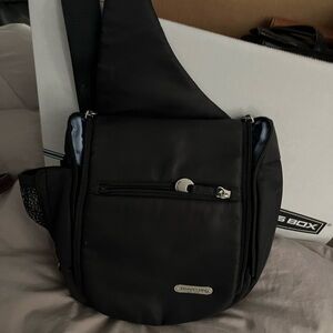 Travelon Black Messenger Bag with Adjustable Strap and Flap Closure